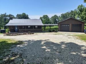 Heres a beautiful move in ready log cabin on 7.51 acres M/L with open floor plan, granite counter tops, hardwood floor, large back deck, & oversized garage with extra storage located just minutes from town. Don't miss out on this unique property. All #'s are aprox, Age + SQ. Footage per Assessor.