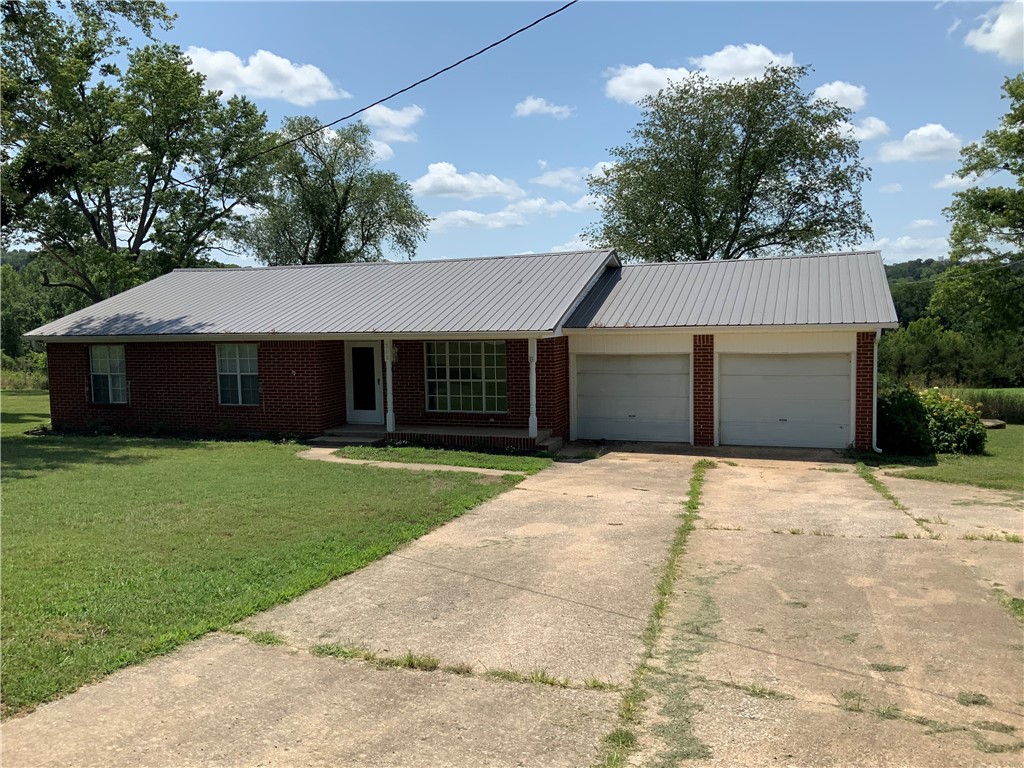 Located in the heart of Huntsville, this well built, 2000sqft m/l, 3 bed 2 1/2 bath home would make a perfect first time home for a new couple, yet has the space for a full family. Roomy open floor plan, large extra living area/bonus room with back porch access to a peaceful view. Large laundry room, 2 car enclosed garage, on an oversized lot with yard to enjoy. Low maintenance exterior with metal roof. Located close to all amenities including groceries, gas, shopping, and Huntsville schools. Recent updates inside and ready to move into, book a viewing today.