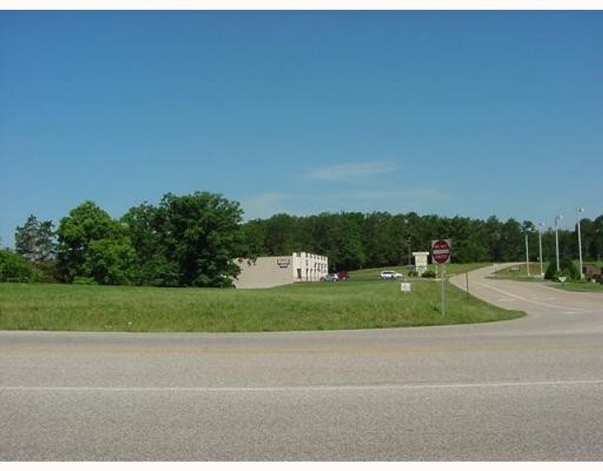 Very level and highly exposed commercial property at corner of Hwy. 62 and Passion Play Road between Phillips 66 Station and Regency Inn on Hwy. 62. Frontage on Passion Play Road is between Walden Plaza and Hwy. 62. In developed commercial area of motels, retail/office centers, and many other businesses, with Washington Regional Medical center, Eureka Springs Police Dept., and the Great Passion Play just down Passion Play Road from the property. For utilities and/or connections to same, please verify with utility companies. Agent has interest in property.
