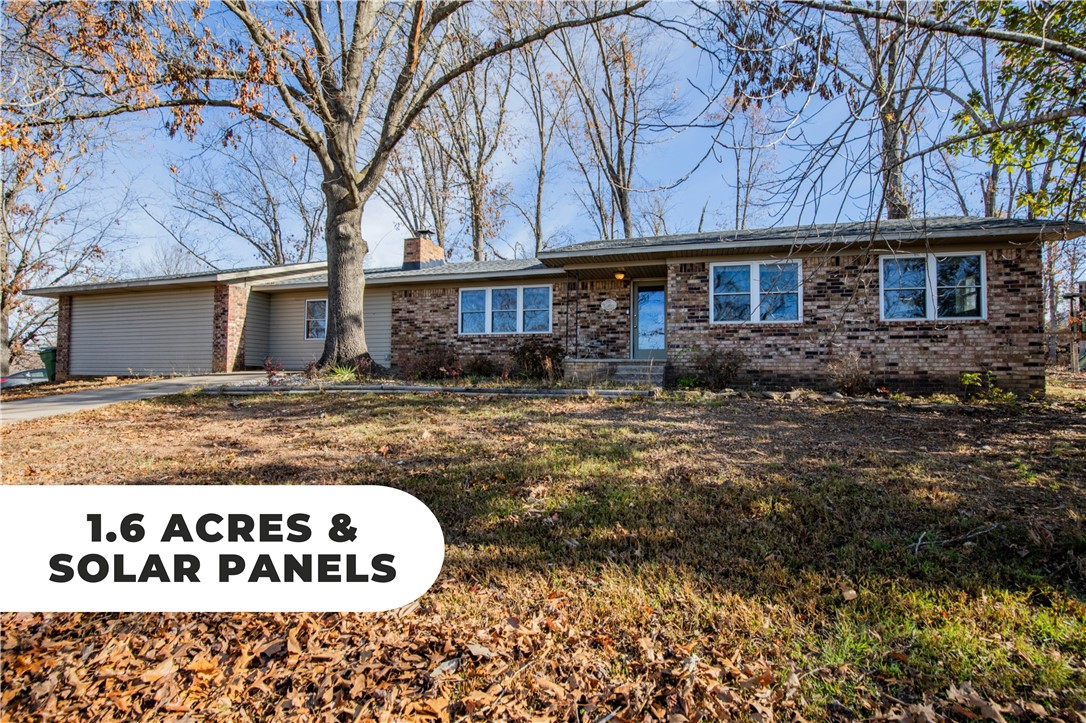 Welcome to this charming 2-bedroom, 2-bathroom home with bonus room nestled on 1.6 acres near Beaver Lake. Enjoy the tranquility of a very private location with seasonal views of Beaver Lake, surrounded by nature across 3 lots that ensure peace and solitude. Also enjoy low energy bills with solar system conveying at no additional cost to Buyer. Whether you're looking for a vacation retreat or a year-round residence, this home provides versatility and comfort. Conveniently located five miles from downtown Rogers, this property offers the perfect blend of privacy and accessibility.