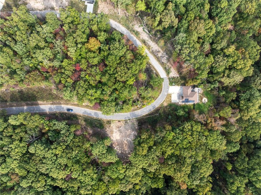Two adjacent flat lots totaling 0.60 acres in a peaceful, scenic area of Bella Vista! The seller has already completed perc tests on both lots and secured an approved sewer plan and permit for the east-facing parcel. Both lots include the same completed build plan—saving you time and upfront costs. The lots remain wooded, offering privacy and natural beauty in a setting surrounded by new homes. Just 5 minutes from Branchwood Recreation Center, 7 minutes to Highlands Golf & Pub, 8 minutes to I-49, and 10 minutes to Loch Lomond Public Boat Launch. A ready-to-go opportunity in one of Bella Vista’s most desirable, fast-growing areas