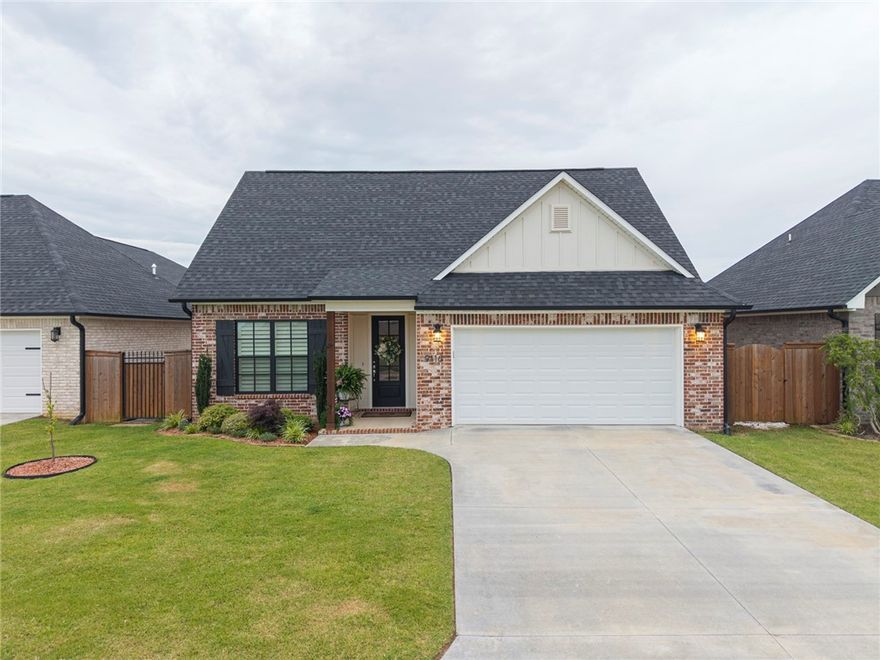 Immaculate and like new, this stunning custom-built home by Emily Rucker is packed with upgrades and thoughtful design touches throughout. Featuring beautiful textured granite surfaces, plantation shutters, and a tiled walk-in shower in the guest bath, every detail has been carefully curated. Enjoy seamless functionality with a sliding barn-style door leading to the laundry room. Step outside to your own private oasis—an extended covered patio with elegant tile, a cozy outdoor fireplace, a tranquil water feature, and a beautifully landscaped backyard complete with three mature trees. A custom stone path leads from the front gate to the backyard, winding through low-maintenance rock gardens. One of the few homes in the neighborhood with both a full sprinkler system and fully landscaped yard—this one truly stands out. Don't miss this rare opportunity to own a pristine, move-in-ready home that blends comfort, luxury, and outdoor living!