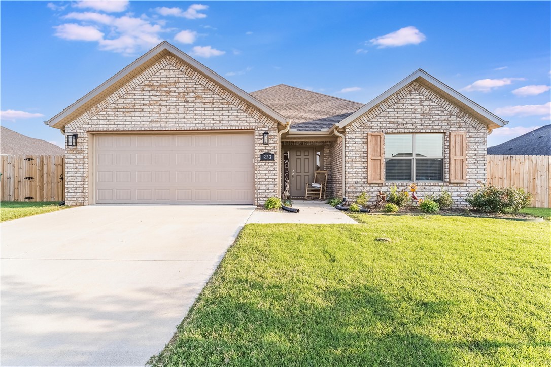 This 2023 single-family 3 bedroom, 2 bath, 2-car garage home is located in the stunning Wagon Wheel Crossing planned community in Farmington. This lovely home features an open floor plan with private master, large walk-in closet, walk-in shower and double sink vanity. The expansive kitchen boasts quartz countertops, bar seating, subway tile backsplash, stainless steel appliances and LVP flooring in the kitchen and main living areas, low E-windows, a covered back porch, and 2-inch faux blinds throughout. Additional amenities that convey include an 8' x 16' outdoor shed, painted red and white, (GO HOGS) and a fully fenced yard. Wagon Wheel Crossing is a quick drive away from the University of Arkansas and downtown Fayetteville! Please call listing agent to show at 479-409-4760.