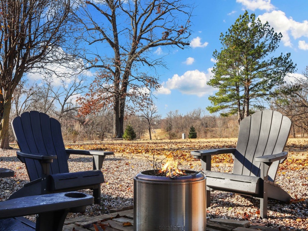 Deciding between a home near trails or on a golf course? Why not have both! This beautifully updated home backs up to the 16th Tee Box on Highlands Golf Course and is in the Highlands of Bella Vista, nationally known for its amazing bike trails. And get this- the seller is willing to sell fully furnished with the right offer. The open-air grotto entrance sets a welcoming tone before you step inside to natural light pouring into the home. The living room features a wood-burning fireplace. The primary bedroom boasts a remodeled bath with a walk-in shower and free-standing tub. The thoughtful split floor plan ensures privacy, with two additional bedrooms on the opposite side of the home. New touches including paint, hardware, lighting, fixtures, and all closets have custom built-ins. Updates also include a new HVAC system (2024) and a roof (2021). The backyard offers a peaceful setting with golf course views and Branchwood Clubhouse is just minutes away. This home is full of character in a prime location.