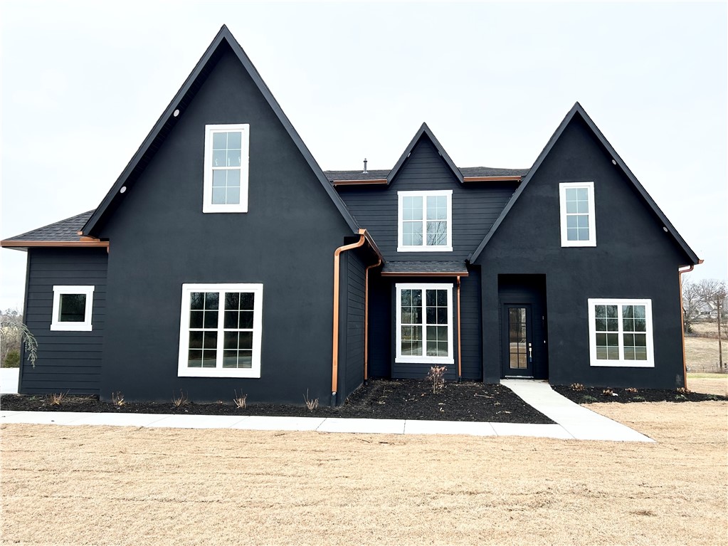New construction on a flat 1 acre estate lot with wooded views! To find on GPS put in Stillhouse Springs Dr Bentonville. This gorgeous custom designed home has 11 ft. ceilings, 22 ft. x 22 ft. living room with a custom fireplace. Custom cabinets to the ceiling with a 6 ft. fridge & 48 in. black range with 8 burners & a double oven. Huge quartz waterfall island, butler's pantry, plus walk-in pantry. So much storage & built ins. Formal dining & home office. Large primary suite with stand alone tub & a huge age in place shower with double heads. Laundry room access off oversized primary closet. Beautiful hardwood floors. Upstairs includes a 19x19 game room, 3 bedrooms, full bath, & a jack & jill bath. Irrigation in front yard. Large covered deck which is gated underneath for mower & plenty of room for future pool equipment. From Cave Springs head west on HWY 264 for 3 miles towards XNA airport. Turn right on Healing Springs Rd. go .4 miles Black house on left at end of street.