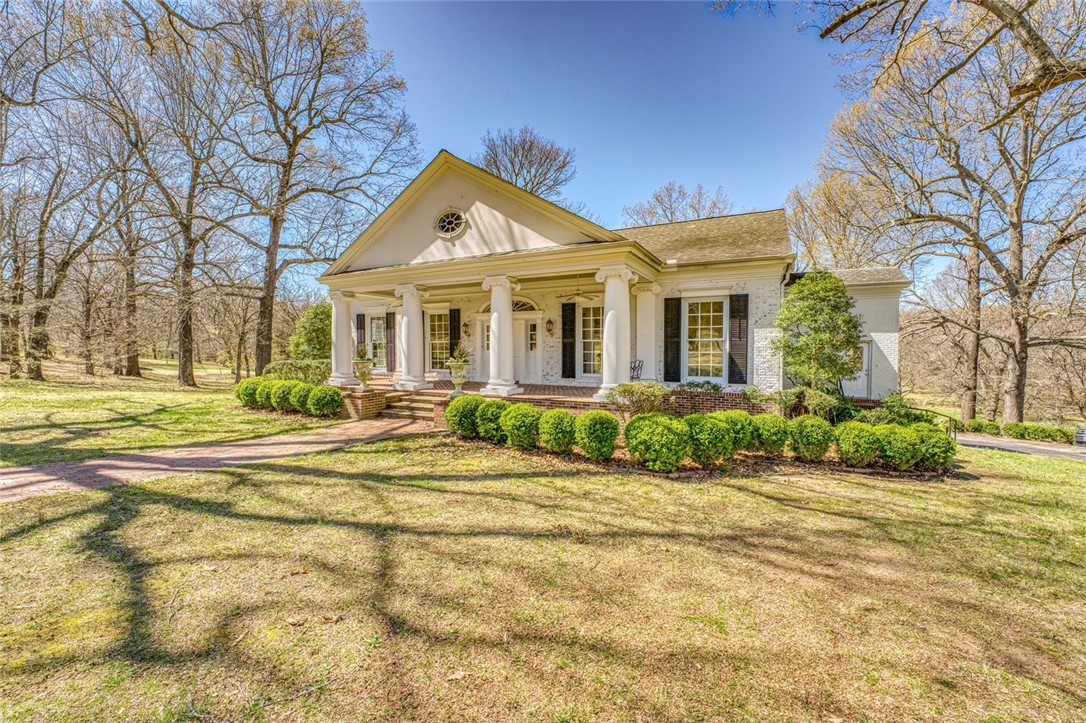 Come home to the finest estate in Harrison: One Meriwether Pond. This Southern Colonial architectural gem is situated on parklike grounds comprised of 13 groomed acres m/l with hundreds of mature oak, hickory, gum, walnut and dogwood trees on a gentle west-facing slope, where deer and other wildlife roam in abundance, all hidden away safely within the Harrison city limits, just minutes from schools, shopping and the historic Courthouse Square. This extraordinary homeāfeatured in the November 2009 issue of At Home In Arkansas magazineācontains approximately 4,800 square feet of gracious living area, 900 square feet of porches, another 900 square feet of storage and an 1,100 square-foot basement with access to the outside. Rich with high-end details such as hardwood floors, solid-core doors, 10-foot ceilings, elaborate crown moldings, Marvin windows and three fireplaces, One Meriwether Pond is ideal for both elegant entertaining and cozy country living in the heart of town. Inquire timely to ensure this opportunity!