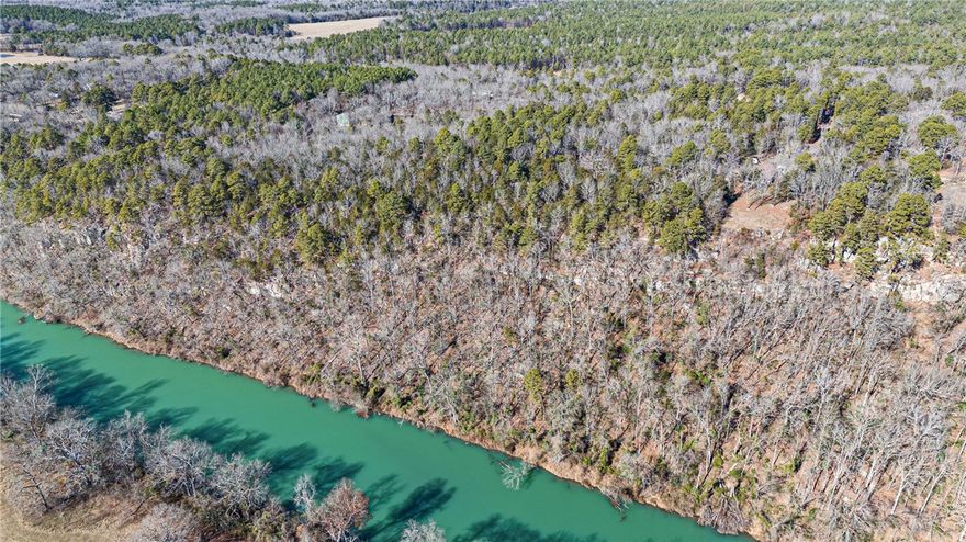 Come discover this extraordinary 10.87 acre property, offering breathtaking views, the picturesque valley, and bordering the serene Illinois Bayou! This is one of the last vacant properties on Tucker Mountain with an unobstructed view, this property presents a rare opportunity to build your dream retreat amidst nature's beauty. Featuring marketable timber, this idyllic location combines privacy with accessibility, making it perfect for outdoor enthusiasts and nature lovers alike. Imagine waking up to panoramic views and endless possibilities for recreation. Don't miss your chance to own a piece of paradise schedule your visit today and embrace the lifestyle you've always wanted!