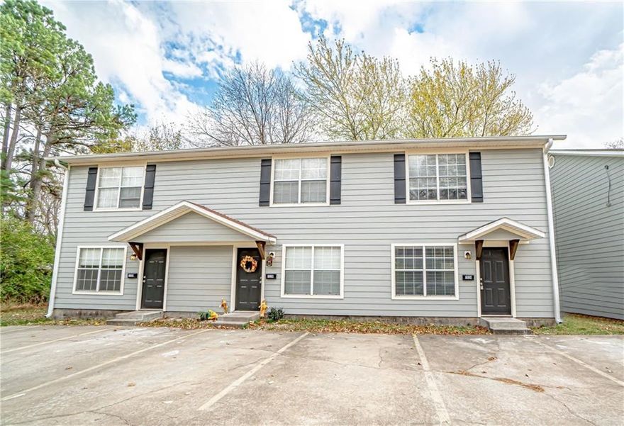 Perfect investment property. Located only 1 mile from University of Arkansas campus, this newly renovated townhome has tons of potential. Perfect investment returning a 7% cap rate. Home has a total of 6 units, each with 2 bedroom and 1.5 baths, complete with a private lot for parking. Featuring an open floor plan, new paint, updated flooring throughout, and gorgeous kitchen backsplash. With the location and the renovations of this property, this is an opportunity you do not want to miss!