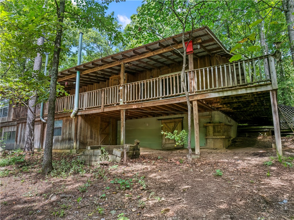 Tucked away at the end of NC 8700, this private retreat is perfect for anyone who craves peace & nature. The custom 2-bed, 2-bath cabin sits on 9± wooded acres with a fully stocked pond—ideal for reeling in catfish or soaking in the view. The south line boasts approx. 800 feet of creek frontage, adding even more beauty & recreation.
Inside, spacious bedrooms pair with a large kitchen featuring hickory cabinets, an oversized island with propane cooktop, & a walk-in pantry. The cabin is fully insulated, equipped with propane backup heat, & even includes a propane light in the kitchen for outages—true off-grid peace of mind.
Step onto the covered back porch, with a screened-in section for year-round enjoyment, or head outdoors where a metal barn offers extra storage. With abundant wildlife & endless privacy, it’s a hunter’s paradise.
Whether for weekends or a full-time lifestyle of seclusion, fishing, & the sound of the creek, this cabin delivers it all.