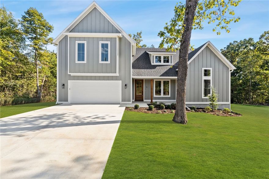 This gorgeous new construction home on a gorgeous lot with huge yard has a perfect layout both for entertaining and a seamless flow of everyday living. This stunning open floor plan features a primary ensuite on main & and 2 additional bedrooms, office plus a flex room and full bath upstairs. Upgraded 3cm quartz counters, beautiful hardwoods throughout main & tile work add luxury and charm to this home! You will appreciate the custom home finishes that set this spec home apart from others in the area. Come home & kick your shoes off in the mud room, drop your socks into the laundry room and grab a snack from the huge pantry on your way in. The large covered deck and privacy in the backyard offer peace and tranquility among the hardwood trees. The kitchen features soft-close cabinets and drawers that complement the serenity of the space.