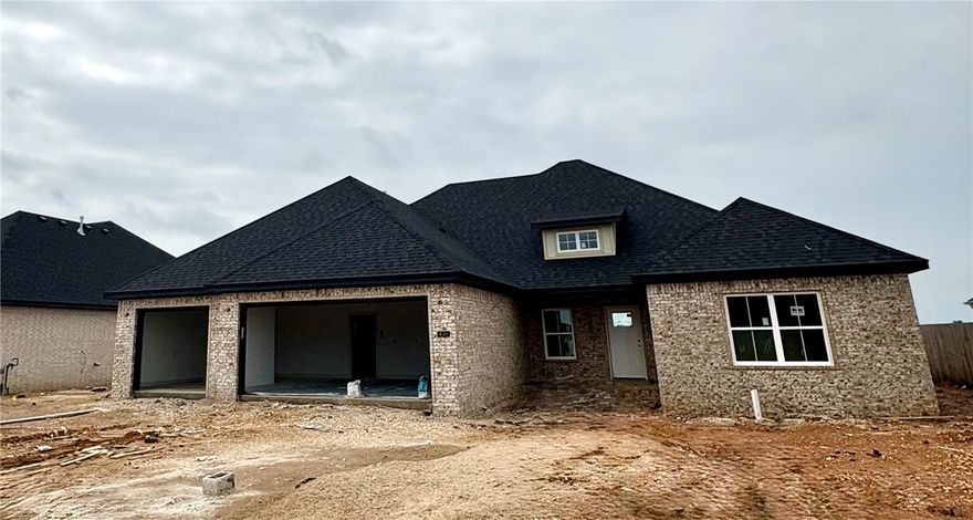 This single-story home invites you in with an open floor plan, vaulted ceilings, and a customized fireplace in the family room. Another room just off entry could be used as a 5th bedroom/flex or office space plus four other spacious bedrooms, three full bathrooms, and generous utility room, laundry, pantry, closets, and a three-car garage. Designer-chosen finishes and details; paint colors, countertops, tile,  engineered wood flooring, accent walls, and lighting. It comes with fence, gutters and blinds. The community has a nice pavilion, pool and playground.  Situated minutes from I-49, Golf Courses, Winery, Arvest Ballpark, Arkansas Children's Hospital and good restaurants! Lender credits offered with preferred lender. Home is estimated to be completed by July 4th. Schedule your tour today!!