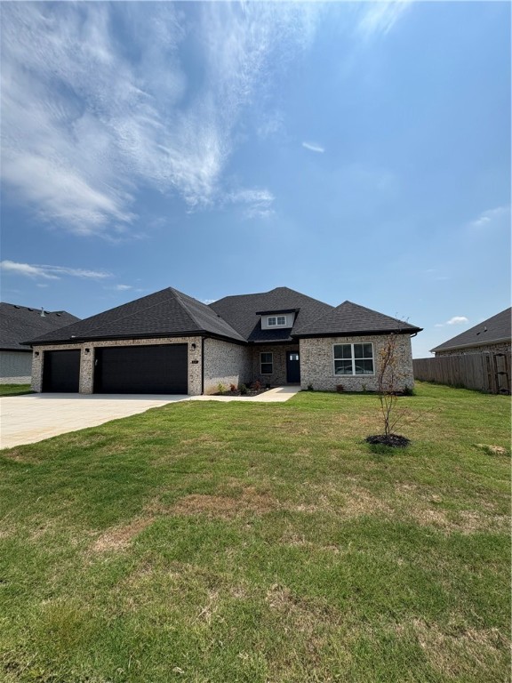 This single-story home invites you in with an open floor plan, vaulted ceilings, and a customized fireplace in the family room. Another room just off entry could be used as a 5th bedroom/flex or office space plus four other spacious bedrooms, three full bathrooms, and generous utility room, laundry, pantry, closets, and a three-car garage. Designer-chosen finishes and details; paint colors, countertops, tile, engineered wood flooring, accent walls, and lighting. It comes with fence, gutters and blinds. The community has a nice pavilion, pool and playground. Situated minutes from I-49, Golf Courses, Winery, Arvest Ballpark, Arkansas Children's Hospital and good restaurants! Lender credits up to $5000.00 offered with preferred lender. Home is estimated to be completed by July 4th. Schedule your tour today!!