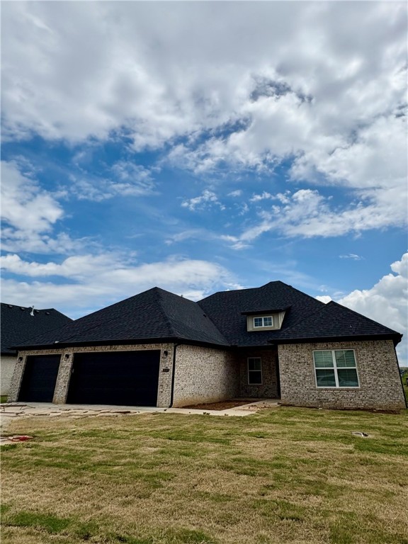 This single-story home invites you in with an open floor plan, vaulted ceilings, and a customized fireplace in the family room. Another room just off entry could be used as a 5th bedroom/flex or office space plus four other spacious bedrooms, three full bathrooms, and generous utility room, laundry, pantry, closets, and a three-car garage. Designer-chosen finishes and details; paint colors, countertops, tile, engineered wood flooring, accent walls, and lighting. It comes with fence, gutters and blinds. The community has a nice pavilion, pool and playground. Situated minutes from I-49, Golf Courses, Winery, Arvest Ballpark, Arkansas Children's Hospital and good restaurants! Lender credits offered with preferred lender. Home is estimated to be completed by July 4th. Schedule your tour today!!