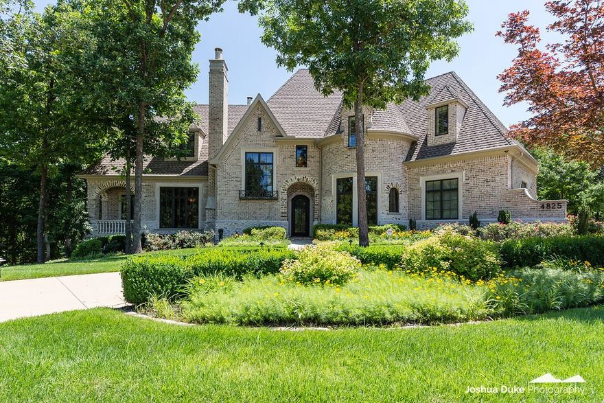 Stunning European designed home overlooking the 10th hole of the Blessings Golf Course. Beautiful open living spaces adorned by beamed ceilings, Brazilian walnut floorings and brick wall accents. Indoor living flows seamlessly to the outdoor entertaining area with custom La Cantina accordion glass wall doors. The kitchen features new top of the line appliances, renovated cabinetry and upgraded exotic granite. Main level Master Suite features soaring ceilings, hardwoods, spacious bath and master closet. 5 Bedrooms, 5.5 Baths, and fabulous media room plus so much more.