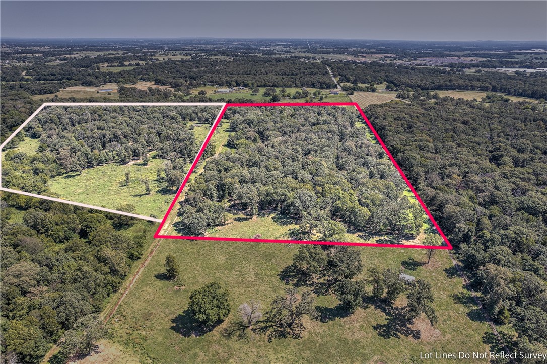 Looking for Space on the Edge of Town then take a look at this 19 Acres just minutes to Centerton, Bentonville and XNA Airport. This land is mostly wooded with some open area. There is a small existing pond. This land is subject to a lot split and easements. There is potential for more land to be purchased and or a existing home. This available tract is the picture outlined in RED