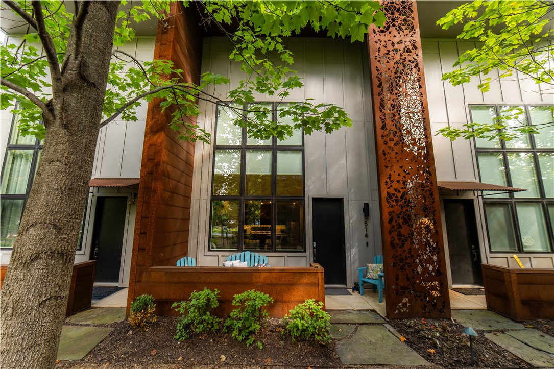 Welcome home! Modern design meets downtown convenience. Located in Bentonvilleās vibrant Market District, this three-story, 3 bed/2.5 bath, w/attached garage, townhome features bold architectural elements, including exposed brick, soaring ceilings, and a dramatic two-story living space. A flexible loft area offers the perfect spot for a home office, lounge, or creative studio. This home is TURN KEY READY, ideal for short-term rental use or immediate move-in. Enjoy a completely private courtyard, perfect for quiet mornings or intimate gatherings, plus access to a shared, professionally landscaped courtyard that adds to the charm and design-forward appeal of the property. An attached private garage offers rare convenience in this walkable locationājust steps from Crystal Bridges, the trail system, 8th Street Market, and some of Bentonvilleās most celebrated restaurants and shops. This home delivers a one-of-a-kind living experience in the heart of Northwest Arkansas. Furnishings able to convey with acceptable offer.