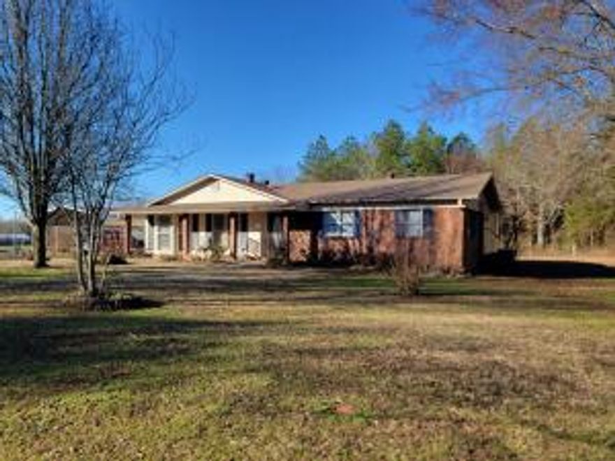 If you are wanting a home in the country that is close to town for your daily needs, this is the house for you! This lovely home sits on one acre. It has 3 bedrooms, 2 full baths, a shop, and two detached metal carports. The shop is equipped with electricity. The roof, heat/air along with other updates have been within the last 4 years.