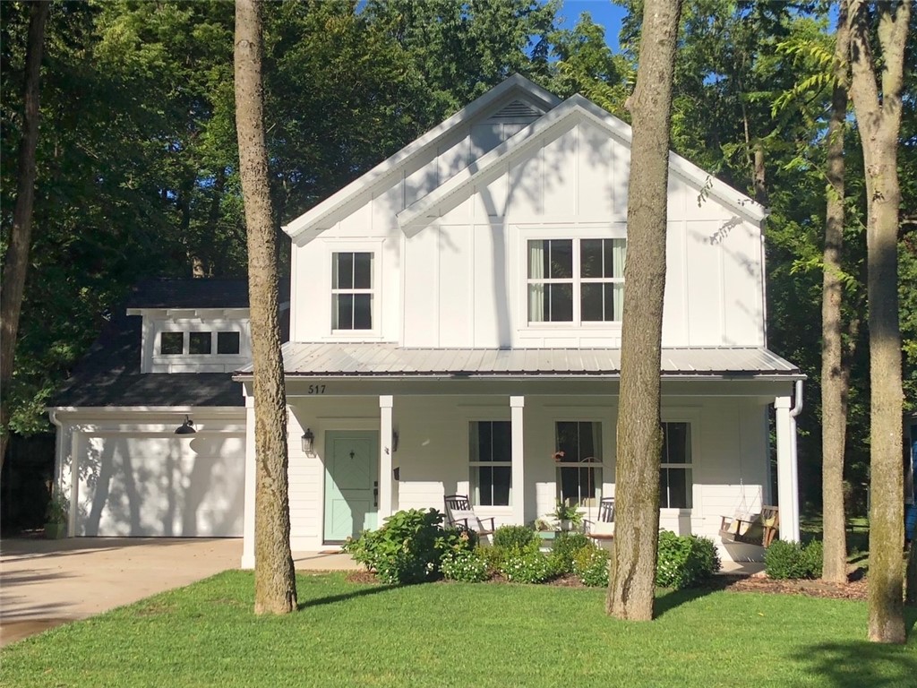 Beautifully maintained home built in 2015 in Fayetteville's Historic District. Walking distance to Fayetteville square, Dickson St, U of A, & Wilson Park. Open floor plan with beautifully refinished hardwood floors, new hardwood stairs & all new upgraded carpet, wood burning fireplace, large kitchen island with stainless appliances. Owner suite is on the main level with three bedrooms and bonus room on second level. Patio is partially covered with pre-wiring for tv and a built-in coyote stainless grill and fridge. Large fenced backyard with mature trees. Two car garage has epoxy flooring plus 3rd tandem bay/workshop area. This home is move-in ready. A must see.