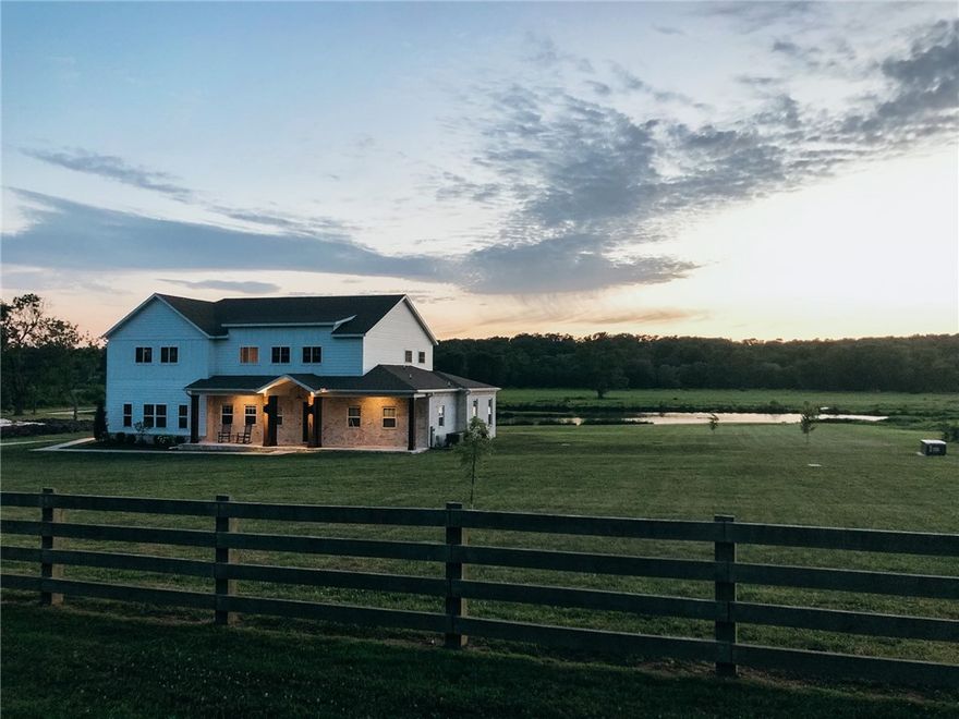 One of a kind 6.16 acre property in one of the most sought after areas in Northwest Arkansas. Nestled in Little Osage Valley, this custom built house boasts 4 spacious bedrooms, 3.5 baths, a large living space with a wood burning fireplace and two covered porches where you can spend hours taking in the exquisite views. Love to entertain? This home has a large open living and kitchen area with an oversized entry that doubles as a sitting space for any gatherings. An oversized master bedroom with large picture window showcasing an uninterrupted view of the land and a spacious en-suite bathroom with deep soaking tub, you have a relaxing oasis to retreat to each day. Upstairs you’ll find 3 large bedrooms, 2 full bathrooms and 330 +/- square feet of unfinished space just waiting for your personal touch. The outdoors are equally as stunning as indoors with a fish pond giving way to acres of green space eventually leading to 10 + acres of common area and personal access to Little Osage Creek.