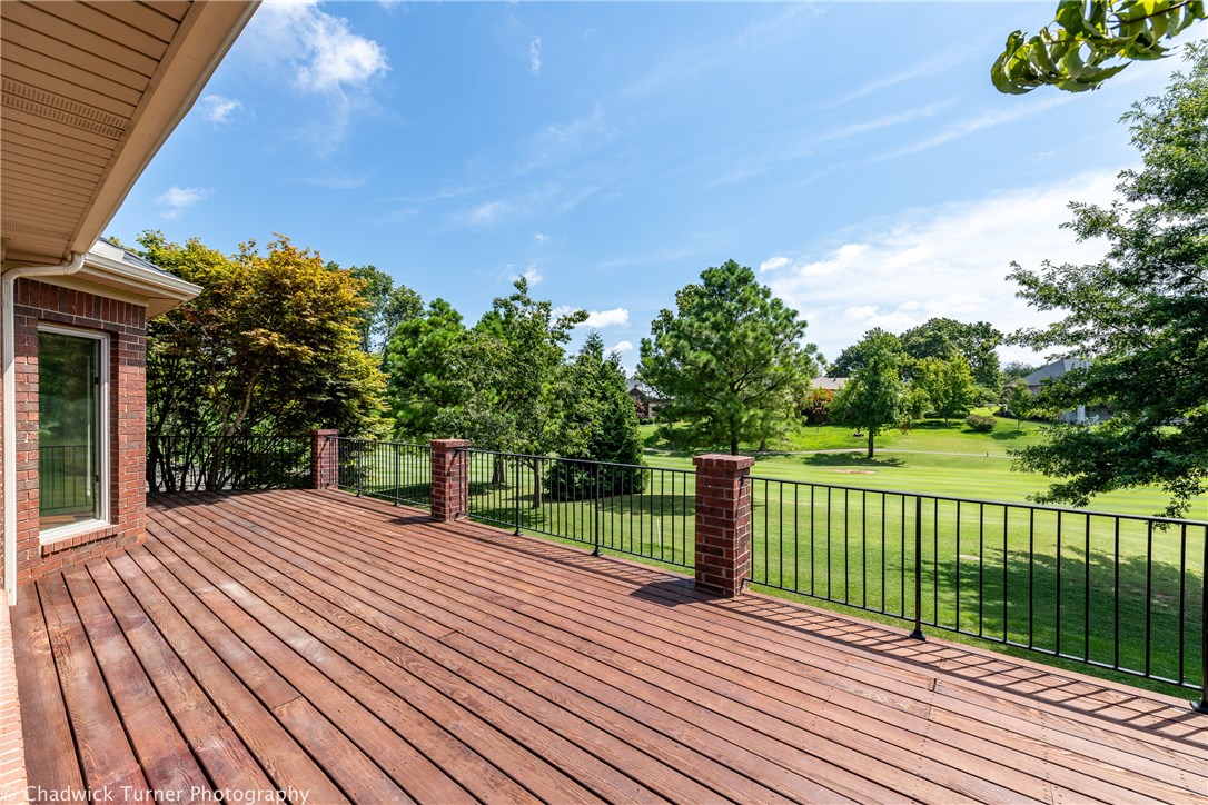 A beautiful oak greets you in the front and a manicured golf course is off your back yard. Superlative design meets extraordinary comfort in this custom Pinnacle home with panoramic views overlooking the 12th fairway from an expansive deck that stretches the length of the house with a separate covered deck and sunroom. Walk into an open flow of living, kitchen and dining areas featuring a double-sided stone fireplace and a kitchen designed for a culinary chef with a massive granite center island, 5-burner gas stovetop and vented hood! You’ll enjoy the split floor plan with 2 guest bedrooms with en suites and private balcony and deck access on one side and spacious master suite on the other. This house is great for both entertaining and relaxing!