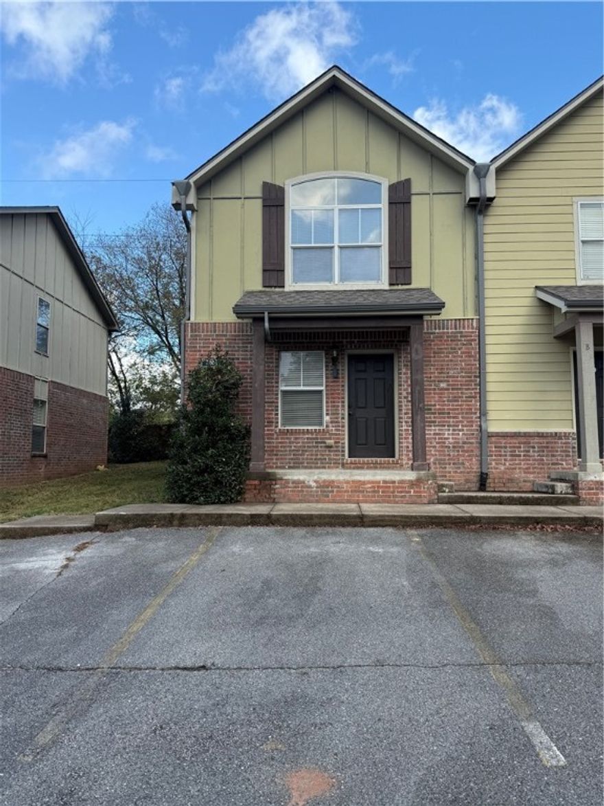 1,150 +/- Sq ft end unit townhouse in an incredible NWA location. 2 primary bedrooms and 2 bathrooms upstairs with a half bath down. Great living room with an electric fireplace. New carpet and paint. Washer/Dryer/Refrigerator included