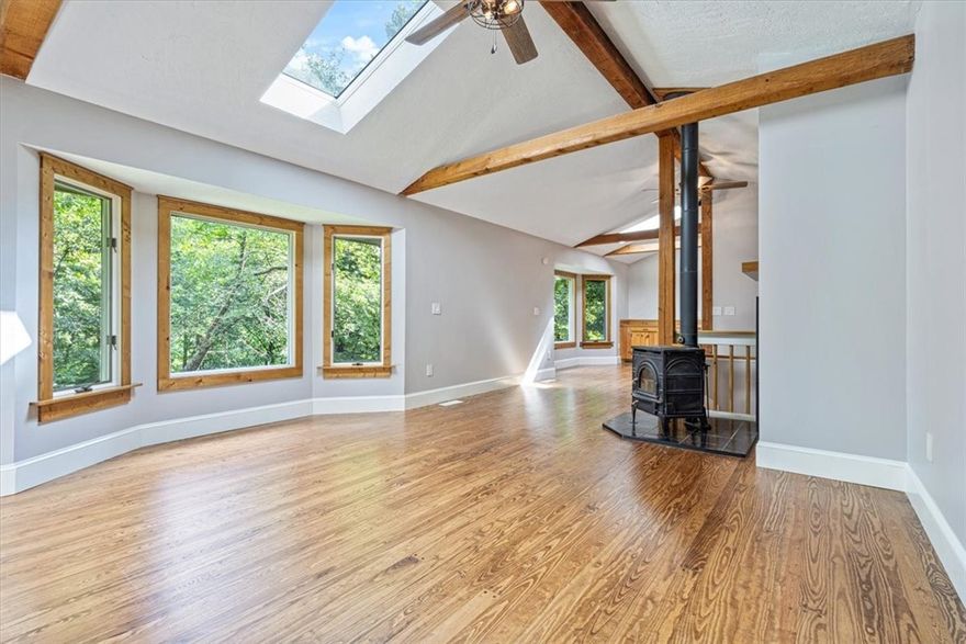 Nestled on 6.31 acres of wooded land with nature right outside your front door, this updated log-sided home blends rustic charm with modern comfort. Recent improvements include a new roof and skylights (2023), new furnace and water heater (2024), whole-house water filtration, refinished and new hardwoods, remodeled primary bath, new deck off the primary bedroom, and new refrigerator/washer/dryer included. Home also features additional den or office space. Outdoor enthusiasts will love being minutes from Illinois River and Gypsy Camp canoeing, WOKA Whitewater Park, Fisher Ford Kayak Park, and 6 miles of bike trails to WOKA. Ideal as a full-time home, weekend retreat, or short-term rental—downtown Siloam Springs shops and restaurants are only a quick 10-minute drive.