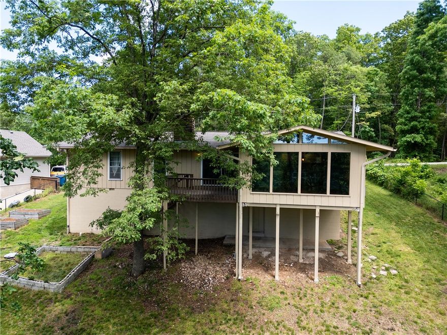 It’s all about the view—this Bella Vista home looks out over the golf course and Sugar Creek, and it’s the kind of scene you don’t get tired of. Enjoy updates throughout and convenient access to some of Bella Vista's best amenities. Access to Mountain Biking trail, "it'll Bluff Out" from your backyard, and walking distance to Lake Rayburn. Recent updates include HVAC, roof, septic tank, and flooring. This home offers a mix of comfort and scenery. Whether sipping coffee on the deck or winding down after a long day in the sunroom, the setting does the heavy lifting. Enjoy extra space in a recently completed office/bonus room downstairs.