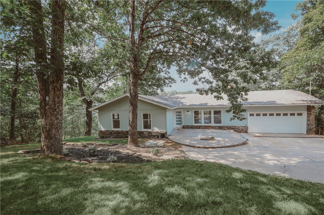 Completely Remade top to bottom. Updated and refreshed. Including all new appliances. Wooded setting makes you feel like you're in the country and the wildlife enhances that feeling. Private boat dock in the cove with a golf cart path access. 2 levels of decks have great and private views of the lake and yard. All bedrooms on main level and downstairs completely finished with 2nd living area, flex room for exercise, crafts, workshop or storage. Full bath down. Storm shelter under deck with access from all levels. Close in lake living, Level backyard for playscape, firepit or pool. Newly sodded yard and landscaping. Just a little less than 1 acre.
Seller still working on final touchups.
Please check out all the pictures and virtual tour videos