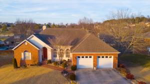 Located near the golf course in the sought after The Greens Subdivision is this beautiful 5 bedroom, 3 1/2 bath, brick home. The home features an excellent floor plan with a gas fireplace, huge family room, large master bedroom & master bath with whirlpool tub & walk-in shower, full finished basement with workshop area & a garage area for that golf cart! This lovely home has so many unmentioned amenities that you will have to see it for yourself!