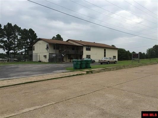 Great investment opportunity! Large shop with 14' drive in doors, workshop, and indoor/outdoor storage. Two apartments are identical with twobedrooms two bath all electric with central air and heat. One unit is two stories with two bedroom one bath all electric with central air and heat.Back yard is fenced in for security. Long term existing renters. Many great opportunities with this one! Broker Owned.
