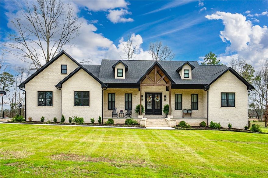 Welcome to your private country retreat! This stunning 3 bedroom, 2.5 bath home offering 2,750 square feet sits on 10+/- beautiful acres and combines modern comfort with peaceful country living. From the moment you arrive, you'll be drawn to the home's charming curb appeal, welcoming covered front porch, and beautifully maintained grounds. The property features a large scenic pond and a .55-mile walking trail, perfect for morning walks, evening sunsets, and enjoying the natural surroundings. The grounds are thoughtfully landscaped and include an abundance of fruit-bearing plants such as mature blackberries, elderberries, cherry trees, young apple trees, and fig trees, creating your own private orchard. Need space for hobbies, equipment, or projects? The impressive 30x40 fully insulated shop includes water and electric, a 12-foot overhang for additional covered work space, and is already stubbed for a future bathroom. This property offers country charm while still being close to town conveniences.