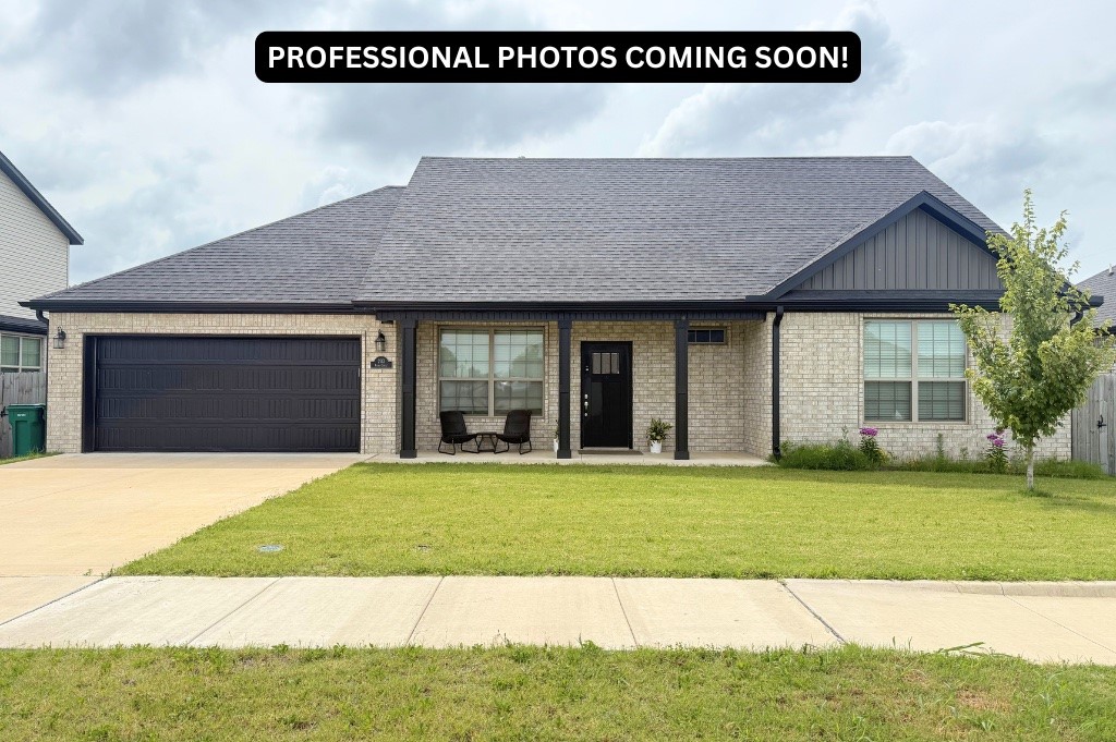 Discover comfort and style in this beautiful 4 bed, 3 bath east-facing home in the heart of Centerton! Featuring a full brick exterior, covered front porch, and spacious back patio, this home offers great curb appeal and outdoor living. Inside, enjoy the open-concept layout with wood-look tile flooring and a cozy gas fireplace. The kitchen shines with custom cabinetry, stainless steel appliances, gas range, pantry, eat-in dining, and bar seating. The main level features 2 bedrooms and 2 full baths, including a private primary suite with dual vanities and walk-in closet, plus laundry room. Upstairs offers 2 more bedrooms and a full bath, ideal for flexible living. Comes complete with refrigerator, washer, and dryer. The fully fenced backyard is perfect for pets or play. Zoned for Bentonville Schools and close to parks, offices, shopping, and dining. This move-in ready home blends convenience, comfort, and value. Welcome home!