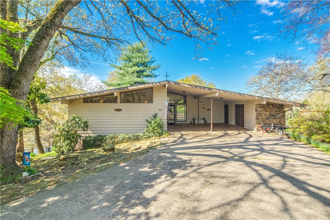 This beautiful home located on the northeast shore of Lake Avalon could easily be called Tranquility Base. The views from both levels of the home are phenomenal, adding an additional level of peacefulness. Spend time relaxing in your living room with large windows open to the world, or, using the interior access to the lower level, go to your 400+ square foot family room. While there, keep an eye out for Bald Eagles flying overhead or deer swimming in the lake. And if things get a bit stressful, just go sit on your private boat dock and dangle your toes in the water. If its storage you require or desire, this home has it and more! Carpet and laminate flooring upstairs were installed approximately 1 years ago and the HVAC system within the last 5.