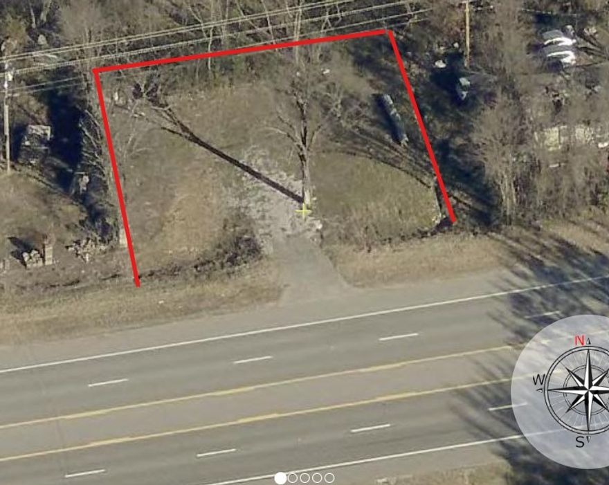 Rare chance to own land along E Hwy 412 in a high-growth corridor. This property offers a variety of possibilities for future use. Ideal for investors or small business owners. Surrounded by residential and mixed-use properties, this location provides both convenience and visibility. Buyer to verify zoning and permitted uses. Property sold as-is.