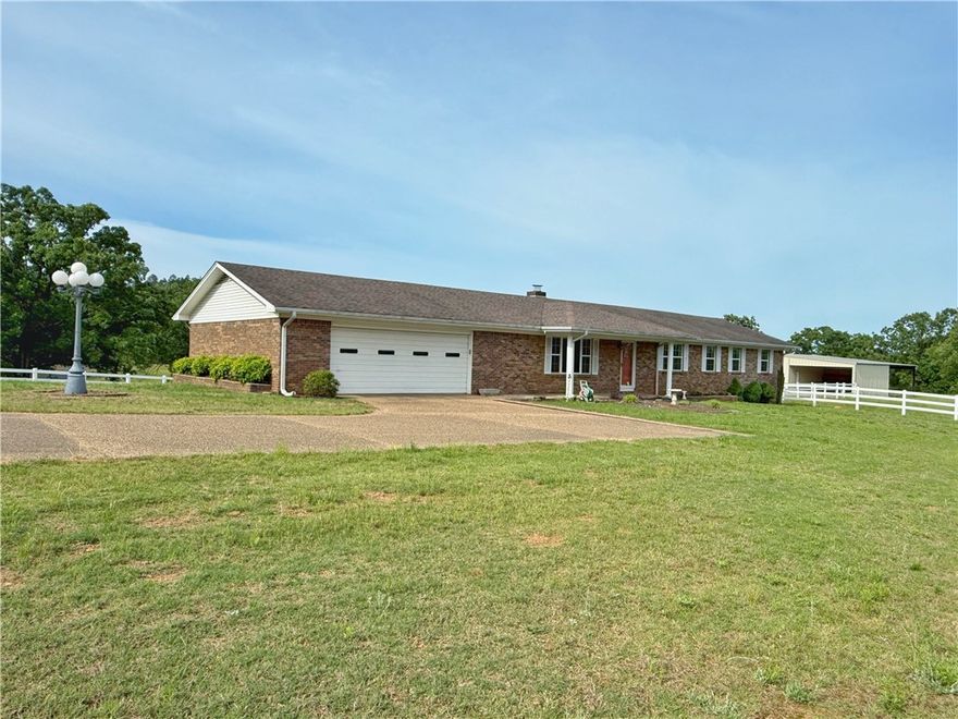 Welcome home! Perched on a scenic hilltop, this 3 bed, 2 bath home offers the perfect blend of space and peaceful country living. Situated on 13 acres of rolling pasture, the home features an updated kitchen with granite countertops, cabinetry with pullouts, and a spacious dining area ideal for gathering and enjoying the views. The oversized primary suite offers comfort and privacy with ample closet space and a large ensuite bath. Two additional bedrooms provide generous space. Bathrooms feature granite and are well maintained. A wood-burning stove adds warmth and charm. Step outside onto the deck and take in the views, perfect for entertaining or relaxing evenings. The walkout basement offers endless possibilities: game room, man cave, or potential 4th bedroom. The true highlight is the 50x50 shop with covered lean-to areas, ideal for equipment, hobbies, or livestock, paired with fenced acreage ready for animals, recreation, and a lifestyle built around space, freedom, and making memories.