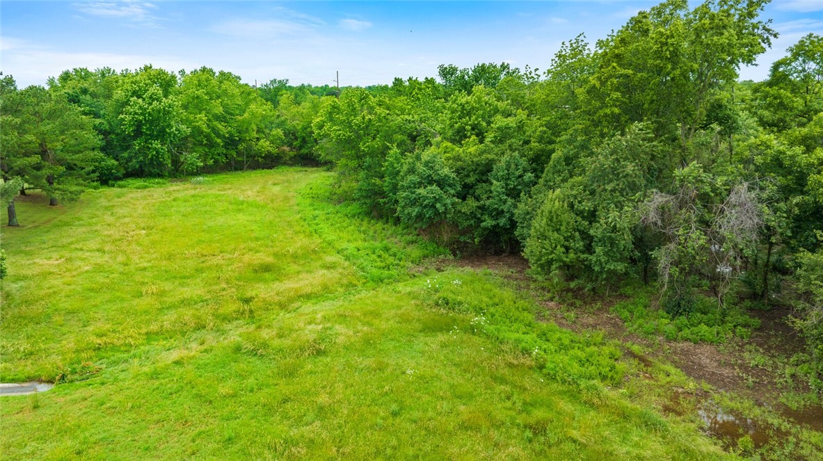Prime 9-acre parcel in Rogers with incredible development potential! Located just off 8th Street, this rare opportunity offers an unbeatable location for personal estate, commercial venture, or future development. Enjoy the natural beauty of a flowing creek along the back of the propertyāperfect blend of convenience and serenity. Donāt miss this one-of-a-kind property in the heart of Northwest Arkansas growth!