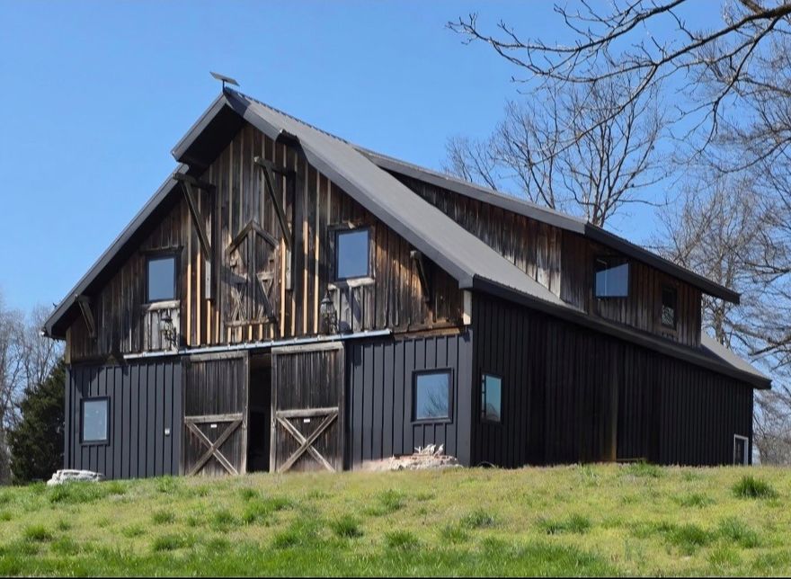 Welcome to this stunning country-style home set on 39 picturesque acres of rolling hills, offering a perfect blend of partially wooded and open clearings. This property is a nature lover's paradise, featuring breathtaking views and a serene atmosphere, ideal for those seeking peace and tranquility. Conveniently located just north of Huntsville, you'll enjoy easy access to Springdale, Fayetteville and Rogers, making it a perfect retreat with modern conveniences nearby. The cozy home features charming interiors and ample outdoor space for entertaining or simply relaxing while soaking in the beautiful surroundings. Don't miss the chance to own this slice of heaven in a tranquil setting!