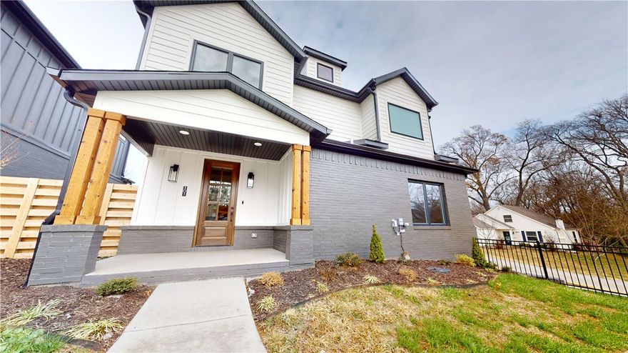 New Construction just blocks from all the action of Downtown Bentonville. This home features all the extras!!! Walk next door for a cup of Airship coffee in the mornings. Walk or bike to the hot spots around the Bentonville square, or cook a delicious meal in this beautiful kitchen featuring quartz counters, GE profile appliances (including fridge), custom soft-close cabinetry, & bar seating.  Rich hardwood flooring, linear fireplace, & surround sound making living easy and comfortable. Extend entertaining to the private side patio, or use the community green space to get together under the covered pavilion w/cafe lighting. The Primary bedroom suite is like a resort. The accent wall & ceiling beams give a wow factor upon walking in. Double closets, double vanities, & a fully tiled double shower makes it feel like vacation everyday. Secondary bedrooms have large walk in closets. See attached feature sheet for all the details!