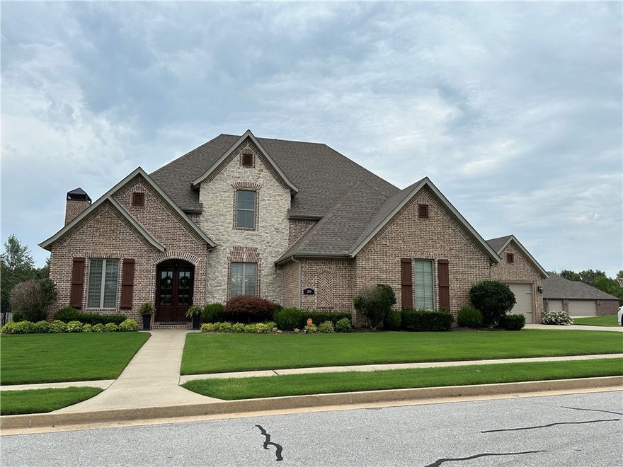 Beautiful Custom Built 4BDR+, 3Bths, 4 Car Garage 0.5 Acre Corner Lot. The Kitchen is A Cooks Dream w/Floor to Ceiling Built Cabinets & 3cm Granite, Huge Center Island W/Seating, Double Convection Ovens, 6 Buner Gas Range w/Grill, Pantry, Wine Cooler, Private Front Office, Built-in Cabinets. The  Living Room w/Wood burning FP, Hardwood Floors, 10 ft Ceiling Downstairs & 9 ft Ceilings Upstairs-Breakfast Area/Hearth Room w/Gas FP that Opens to the Covered Patio & Swimming Pool & Hot Tub. Lovely Primary Suite w/Crown Molding & Bth w/Walk-in Tiled Shower/Whirlpool Tub, Sit-down Vanity- Huge Walk/in Closets. Custom Cabinets that open into the Huge Safe/Shelter Room. Utility Room w/laundry shoot from 2nd floor Lots of Storage Cabinets and 1/2 Bath. Upstairs offers 3 Bdrs & 2 BA. You will Love The Huge Projector Movie Room w/Surround Sound & Plenty of Seating Area & Storage Area. You will Enjoy The Beautiful Swimming Pool/Covered Patios & Hot Tub 1/2Bth & Shower Located in The Estates At Brush Creek Off of Elm Springs Rd.