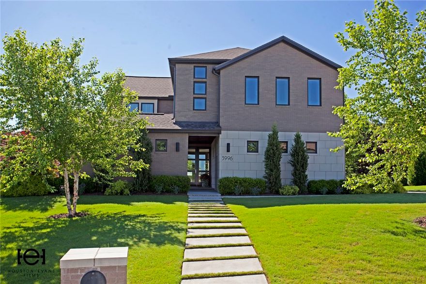 This masterpiece of design and craftsmanship is only 6 minutes from I-49. It has been meticulously maintained and exudes five-star MODERN elegance.  All 4 bedrooms boast sleek en-suite bathrooms, generous closets and beautiful views.  Perfect for entertaining with a gourmet kitchen open to the family room. Watch TV and enjoy a fire on the loggia by the pool.  Unwind in the luxurious master suite with steam shower and towel warmer or watch a movie on the big screen in the media room.