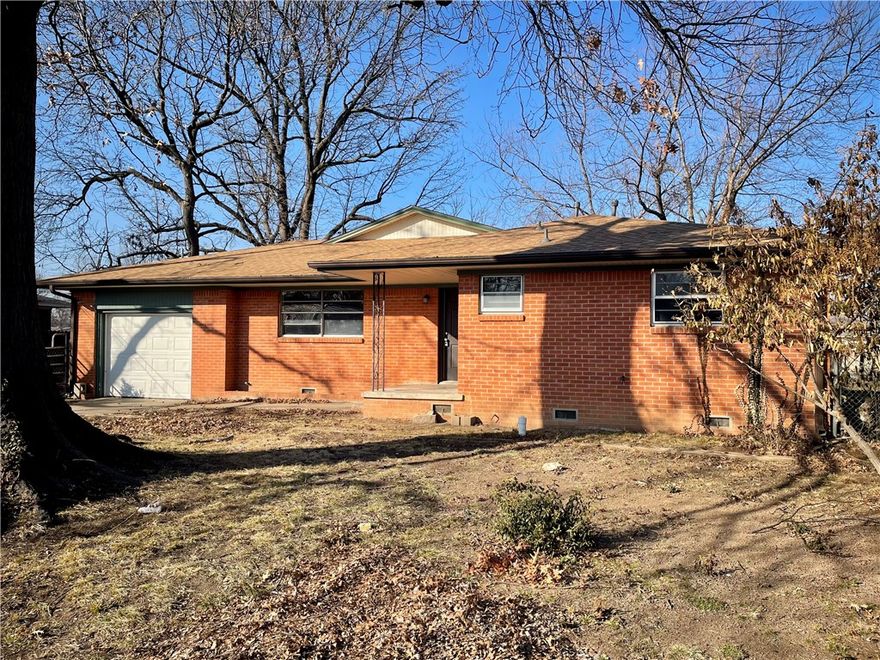 Welcome to this charming 3-bedroom, 3 bath, brick home located in convenient Central Springdale! This property boasts a covered front stoop and large, mature shade trees. Inside, you'll find two spacious living areas, one featuring a cozy hearth fireplace, providing plenty of room for entertaining and relaxation. The eat-in kitchen showcases beautiful granite countertops. The three bathrooms are updated with stylish tile surrounds in the shower and combo tubs/showers. Additional functional spaces include a flex room that would make a great office and a convenient utility/mudroom. Enjoy your morning coffee on the covered back patio overlooking the fenced backyard with storage building. Complete with a 1-car garage and a great location near Huntsville Ave, restaurants, and schools, this home is ready for its new owner!