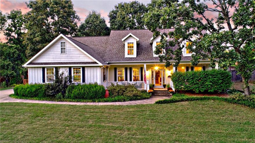 Discover the charm of this 3,390 sq ft two-level farmhouse in the highly sought-after Park Place community in East Fayetteville. Offering 5 bedrooms and 3.5 baths, this home welcomes you with a covered front porch and beautiful landscaping on a .40-acre lot. Inside, the heart of the home is the open kitchen with a massive granite island flowing seamlessly into the living room, complete with built-ins and a cozy gas fireplace. The main level hosts 3 bedrooms, including the primary suite, plus a formal dining room for gatherings. Upstairs, a versatile bonus area sits between two additional bedrooms, while attic walkout storage adds convenience. The backyard is a retreat with tiered, fenced levels for entertaining or relaxing. Residents love the neighborhood amenities—swimming pool, tennis courts, playground, and paved trails—all just steps away. With a new downstairs HVAC and water heater, this home blends comfort, style, and the coveted Park Place lifestyle.