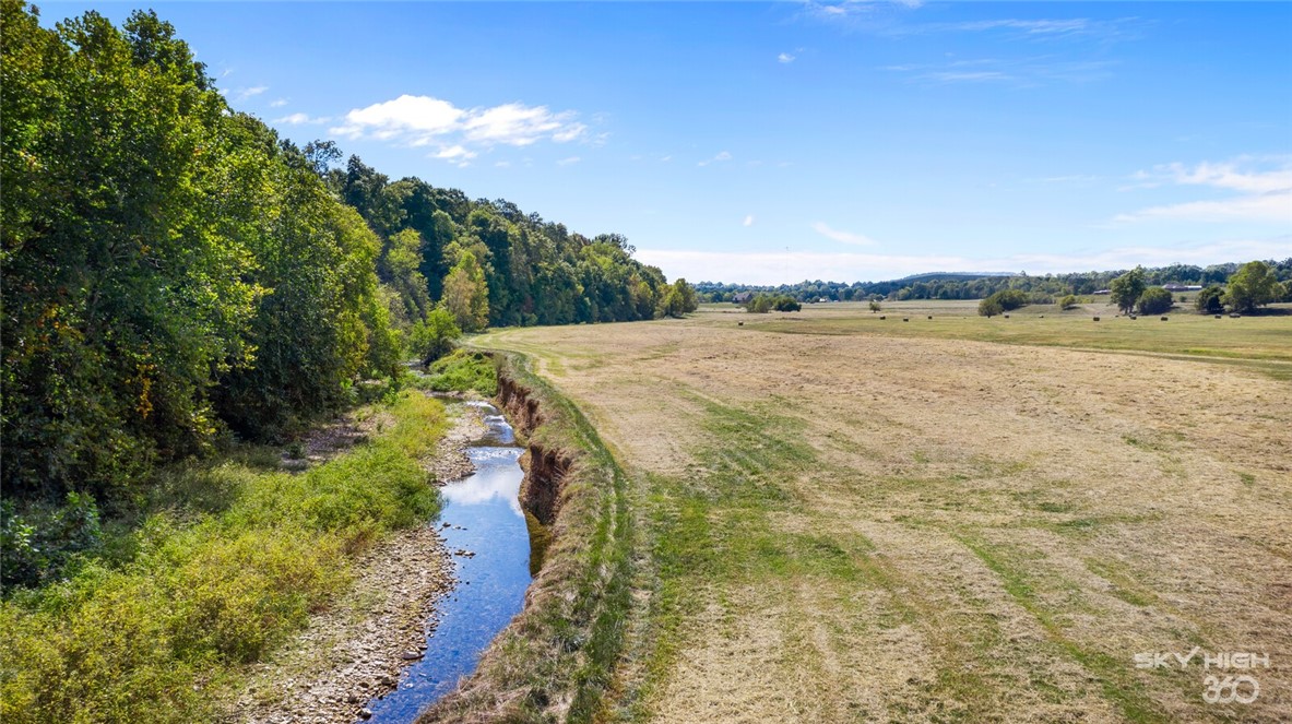Come enjoy the nature on this beautiful property, almost 50 ac (mol) a creek in the back of the property, live water! Have your personal campground with a buildable area on the front or enjoy a wonderful hay field for your cattle! Come see it today! Lincoln water is at the road.