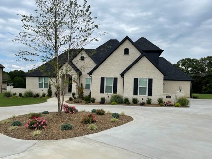 agent owned 4 bedroom 4 1/2  bath with a office large 2.82 acre lot gated community Elm springs Harber schools 1 year old house comes with 2-10 warranty wood floors throughout bonus living room with bar prewired with alarm smokes central vac large over sized 3 car garage
