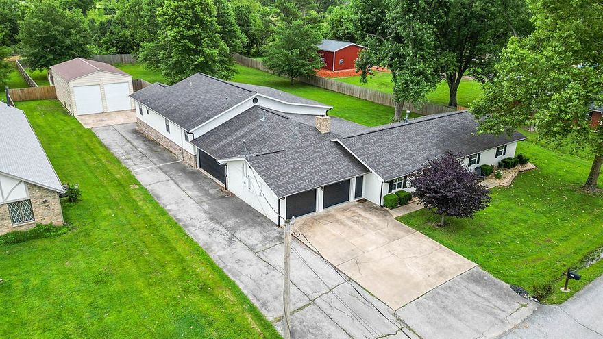 MOTIVATED SELLER!! Experience grandeur at 1711 Mayflower Rd, Bentonville, AR 72713! This 6-bed, 4 -bath estate on 1 acre offers 2 living rooms, 2 kitchens with a marble island in the main, a great room, 2 laundry rooms, and space to thrive. Ideal for multifamily, Airbnb, or retreats, it boasts new flooring, a refreshed master bath, and custom cabinetry. Car lovers rejoice with two 2-car garages and a 24x40 ft detached garage holding 4 cars (8 with lift, current lift excluded), featuring insulation, heated/cooled mini-splits, and secure storage. Updates include HVAC (2024/2023), 50-gal gas water heater (2024), 2016 roof, and 2020 carpet. A storm shelter fits 6-8. Near Thadden Field Airport, Bentonville Brewing, and close to downtown’s various museums, Razorback Greenway, and major Fortune 500 companies; this home blends luxury and convenience. Perfect for growing families or investors, seize this rare gem in booming Northwest Arkansas—book your private showing now!