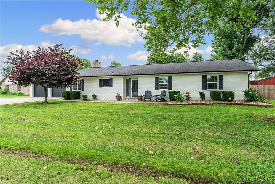 Experience grandeur at 1711 Mayflower Rd, Bentonville, AR 72713! This 6-bed, 4.5-bath estate on 1 acre offers 2 living rooms, 2 kitchens with a marble island in the main, a great room, 2 laundry rooms, and space to thrive. Ideal for multifamily, Airbnb, or retreats, it boasts new flooring, a refreshed master bath, and custom cabinetry. Car lovers rejoice with two 2-car garages and a 30x40 ft detached garage holding 4 cars (8 with lift, current lift excluded), featuring insulation, heated/cooled mini-splits, and secure storage. Updates include HVAC (2024/2023), 50-gal gas water heater (2024), 2016 roof, and 2020 carpet. A storm shelter fits 6-8. Sellers offer $5,000 toward repaint/closing costs. Near Thadden Field Airport, Bentonville Brewing, and close to downtown’s various museums, Razorback Greenway, and major Fortune 500 companies; this home blends luxury and convenience. Perfect for growing families or investors, seize this rare gem in booming Northwest Arkansas—book your private showing now!
