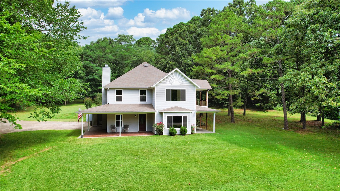 Privacy haven! Craving country living w/ quick town access? This nearly 2-acre gem delivers. Minutes from Beaver Lake & Hickory Creek Park, enjoy easy boating, fishing, and swimming. This spacious 3-bed, 2.5-bath home offers room to gather and grow, with two living areas and generous indoor/outdoor flow. Use the upstairs living area as a game room, office, or homeschool spaceāwith/ wet bar included. Highlights: covered wraparound porch, private balcony off the primary suite, eat-in kitchen, large walk-in pantry, and cozy wood-burning fireplace. Bonus upgrades: new gutters & windows (2023) throughout and upstairs HVAC replaced (2025). Storage is a breeze with an oversized, finished, air-conditioned 2-car garage, covered parking, & shed. Peace, privacy, & convenienceāmove fast!