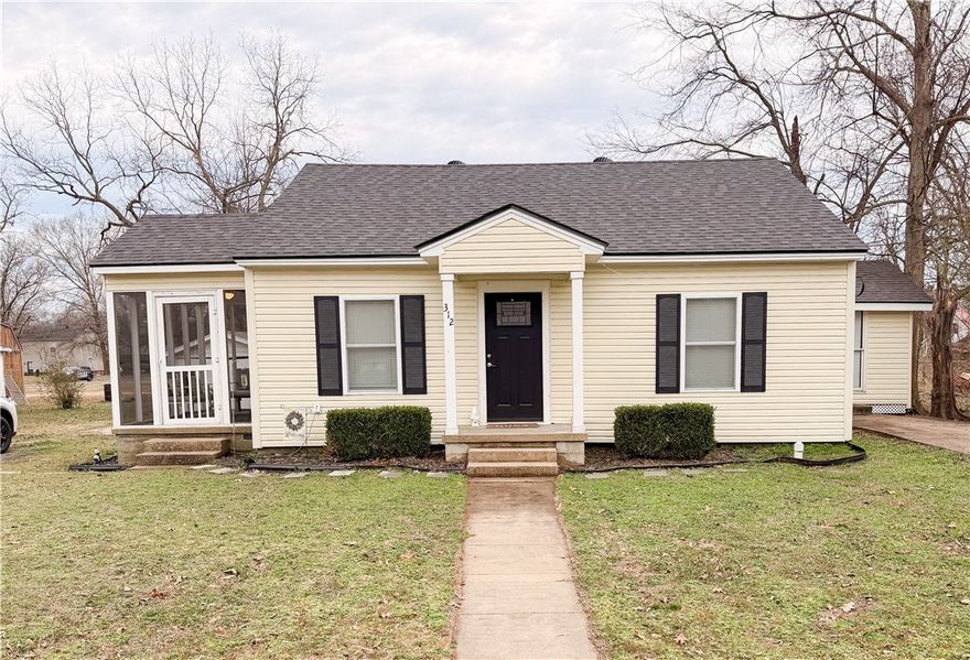 Welcome to this charming 1940 home at 312 E. H St. in the heart of Russellville. This single-level home offers 3 bedrooms and 2 full bathrooms with a thoughtful blend of classic character and modern updates. Inside, you’ll find newly painted interiors, luxury vinyl plank flooring, and a versatile den or office that could also serve as a second living area. The kitchen features granite countertops and connects easily to the main living spaces. A functional mud room adds everyday convenience. Recent updates include a new hot water tank and a new exterior HVAC unit. Outside, enjoy two covered porches—one screened in—perfect for relaxing or entertaining. The property also includes a detached one-car garage and 30-year galvanized shingles. Located near Arkansas Tech University and within walking distance to downtown Russellville’s dining and entertainment, this home offers comfort, charm, and an unbeatable location. Fiber optic internet is available at the street, making it ideal for work-from-home needs.