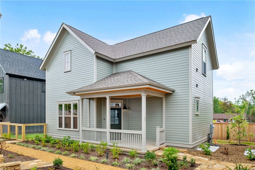 Welcome to the 11th Street Cottages; a new community centered around expertly designed private gardens. Two blocks east of Walker Park and the Greenway Trail, the Cottages are walkable and bikeable to the most sought-after restaurants, shops, neighborhood parks, and art centers in downtown Fayetteville. This floor plan has a spacious living room and open-concept kitchen with generous prep space and bar stool seating at the island. Designed with primary suites and laundry room connections both upstairs and downstairs, the large rooms are complimented by generous walk-in closets and spacious baths. Finished with high-end cabinetry, fixtures, lighting, and ENERGY STAR(r) high performance certified systems for maximum efficiency, comfort & healthy indoor air quality. Enjoy your own private, fenced yard, or join friends and neighbors on the front porch overlooking the community garden.