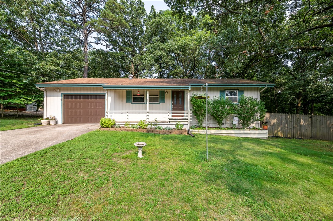 Adorable cottage in Bella Vista surround by mature trees. Located off Trafalgar and around the corner from the bike trails. This two bedroom home has one and a half bathrooms. It features upgraded flooring, a covered back patio and a huge lot. HVAC system was replaced in 2017. New roof coming soon! Don't miss out on this little gem!